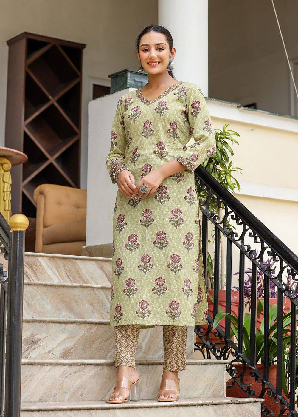 Elegant green floral cotton kurta set with straight trousers.