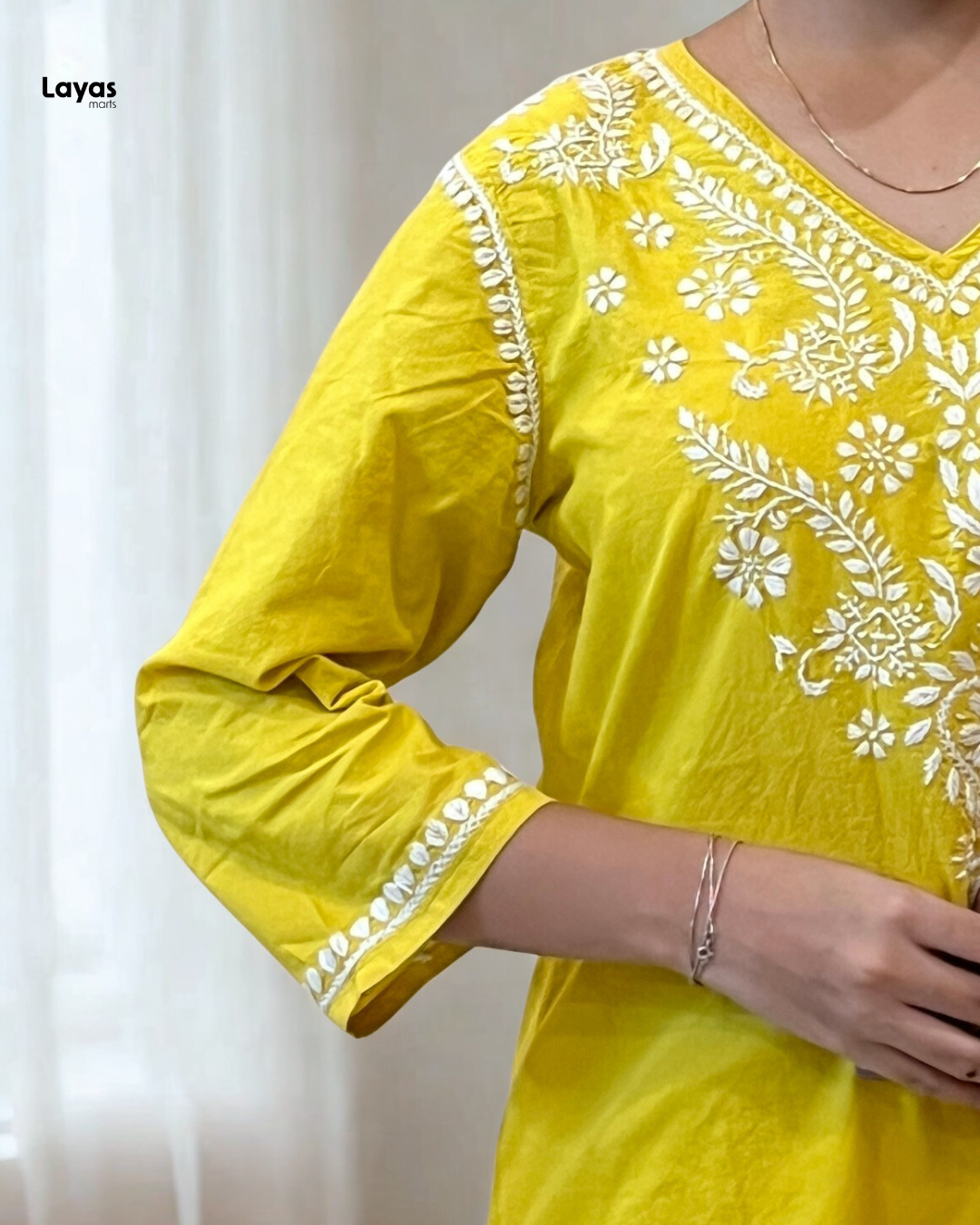 Yellow pure cotton kurti with traditional embroidery