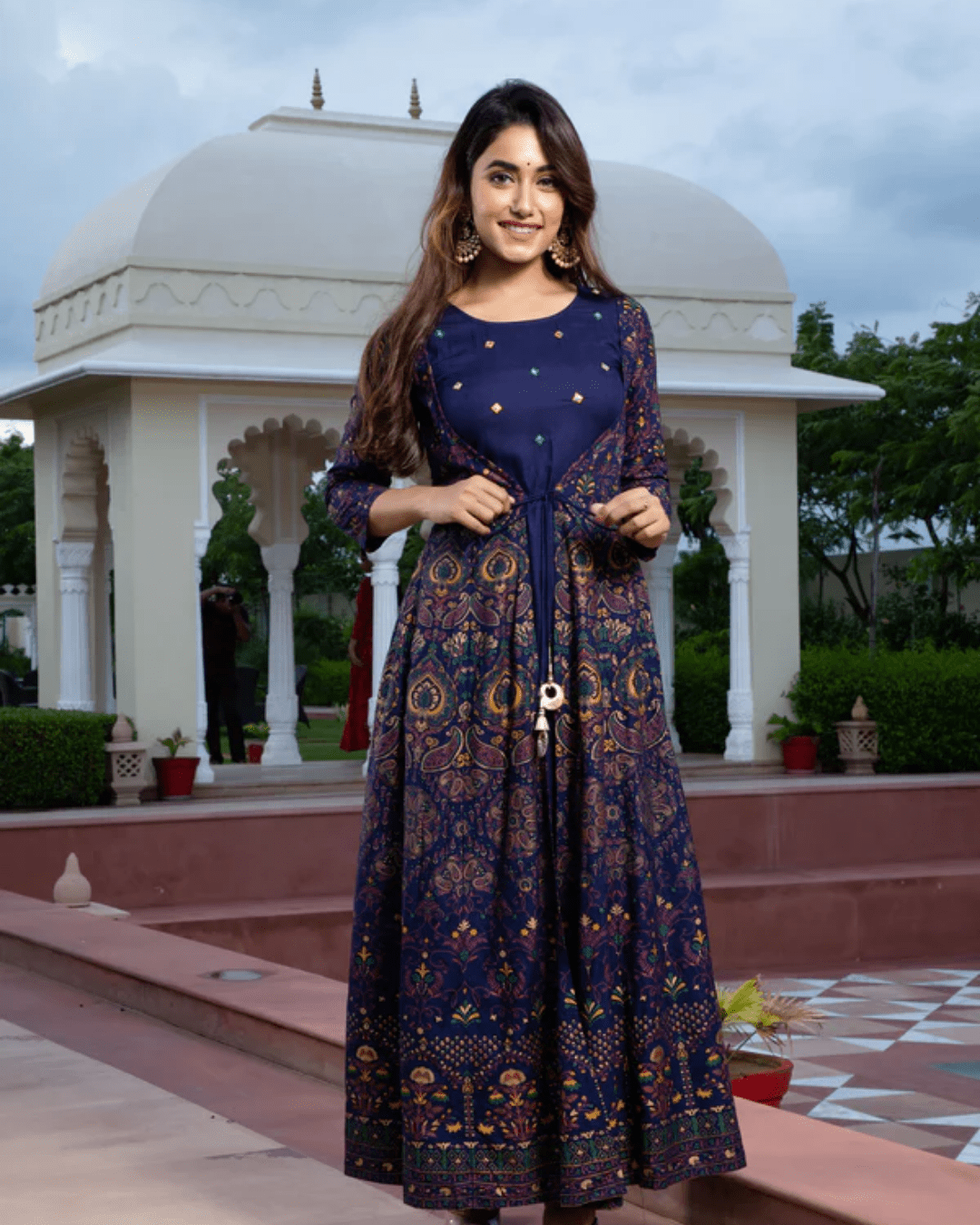 Flared rayon Anarkali kurta in dark blue and red, designed with an elegant jacket and breathable fabric for a stunning ethnic look.