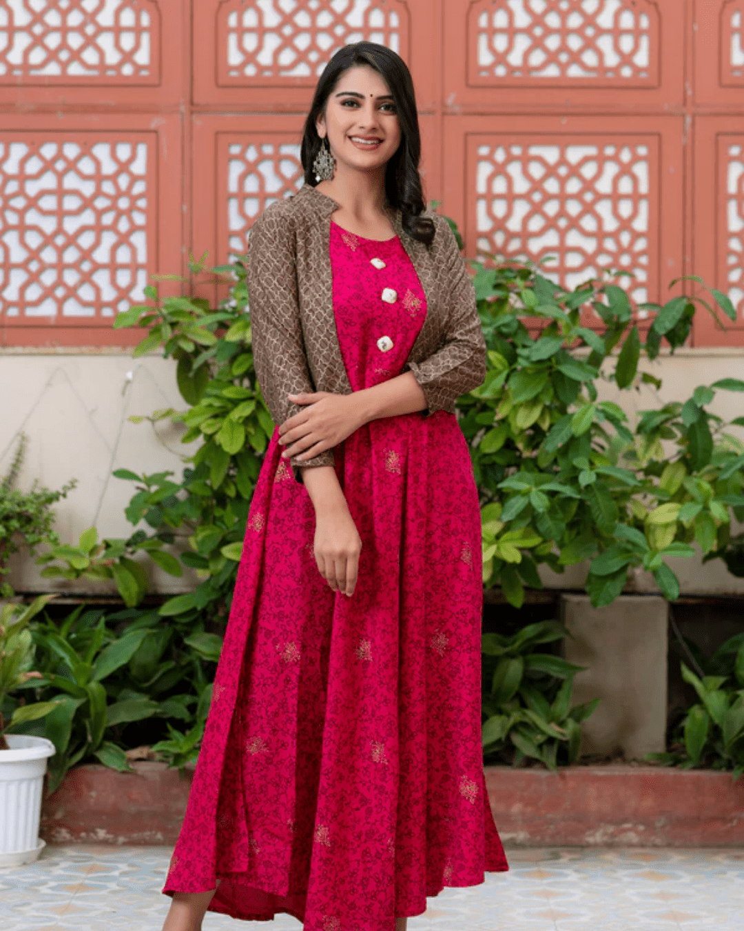 Flared rayon Anarkali kurta in pink with gold print floral details, designed for ethnic celebrations and wedding functions