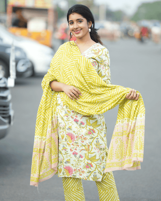 Light Green Floral Cotton Kurta Set for women, featuring a sequin-embroidered kurta, matching trousers, and a lightweight dupatta.