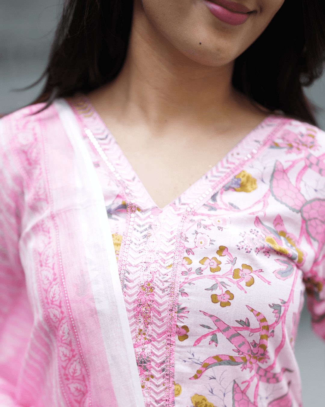 Elegant cotton kurta with floral print, V-neckline, and three-quarter sleeves, perfect for festive and casual wear