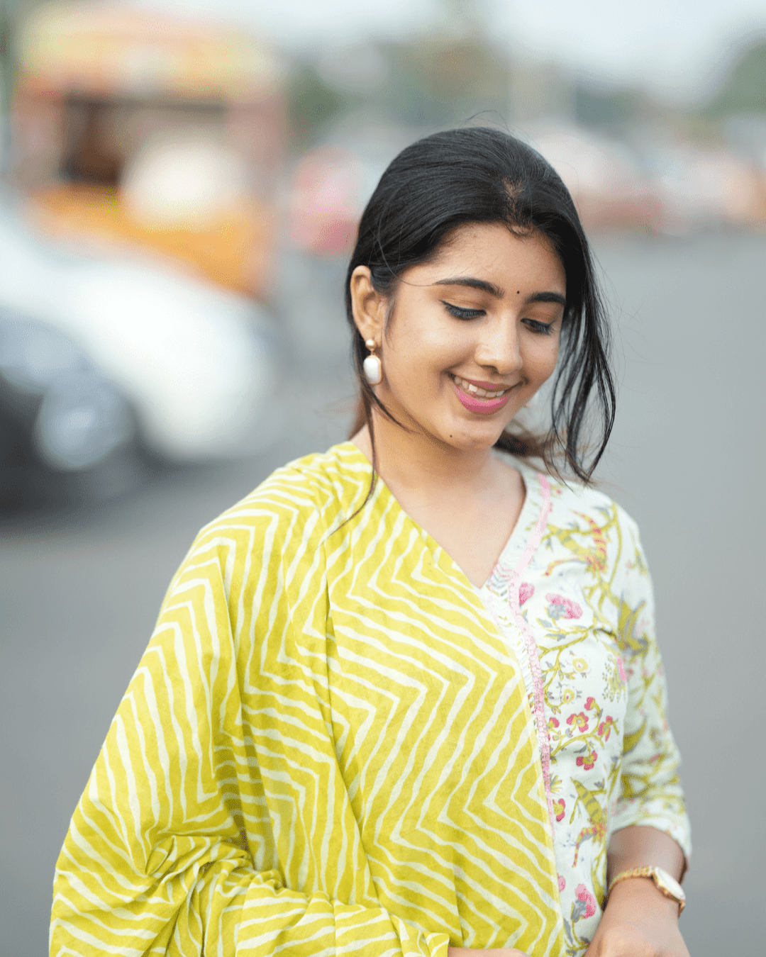 Elegant cotton kurta with floral print, V-neckline, and three-quarter sleeves, perfect for festive and casual wear.