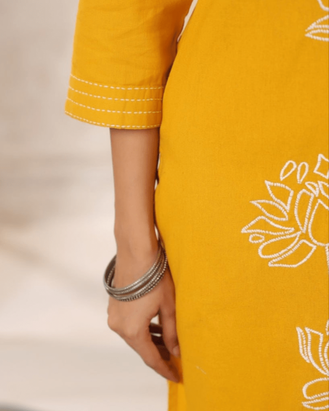 Yellow Floral Embroidered Co-ord Set styled with silver earrings, perfect for festive and casual occasions from Layas Marts.