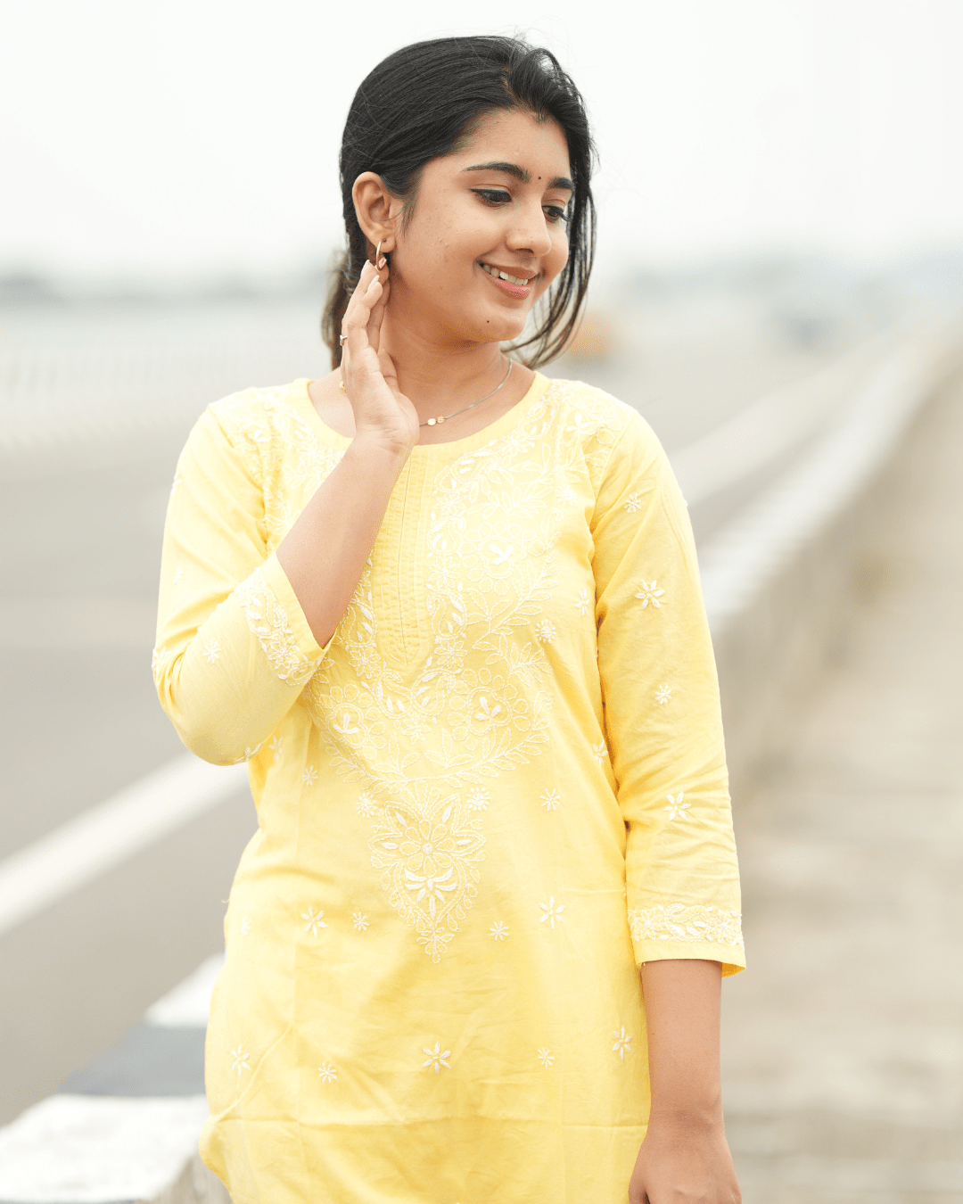 Premium hand-embroidered cotton kurta with a relaxed fit and three-quarter sleeves.