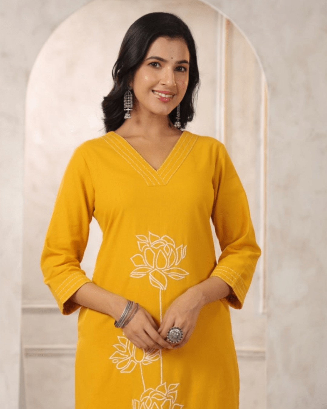 Relaxed-fit trousers with an elastic waistband and pocket, included in the Yellow Embroidered Co-ord Set by Layas Marts.