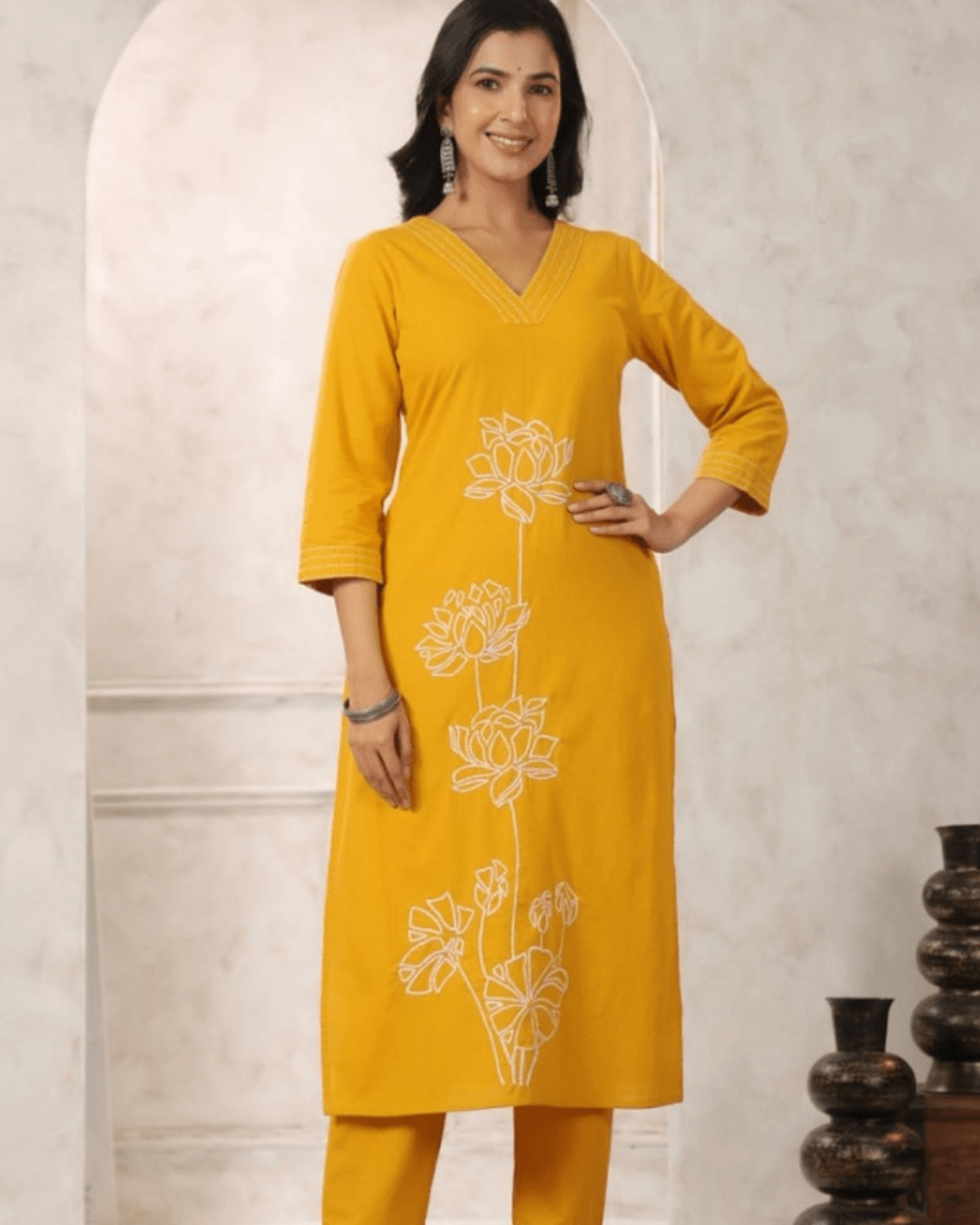 Yellow Floral Embroidered Co-ord Set with V-neck top, relaxed-fit trousers, and earrings from Layas Marts.