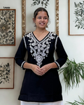 Woman wearing black cotton chikankari short kurti