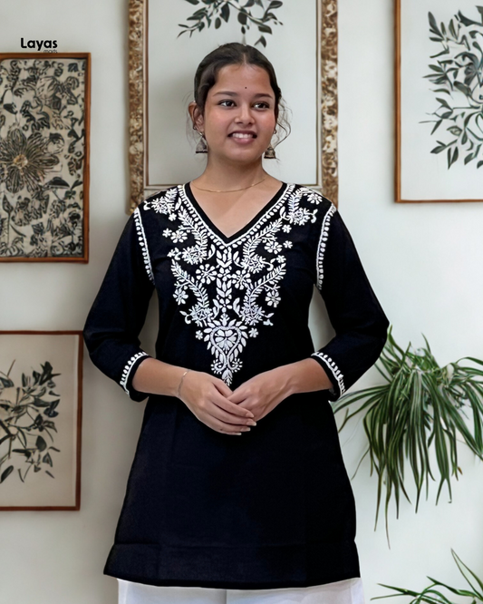 Woman wearing black cotton chikankari short kurti