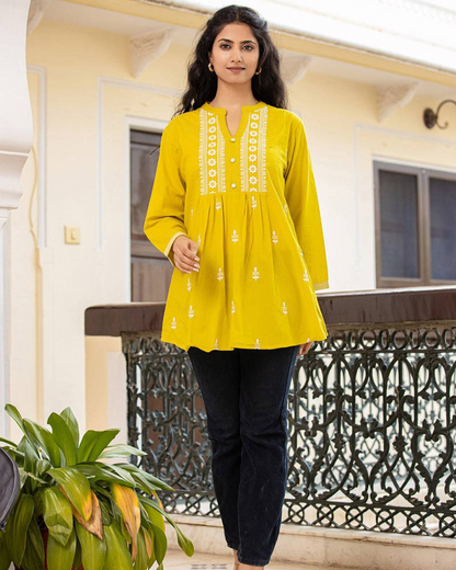 Yellow Cotton Chikankari Short Kurti paired with jeans for a chic casual look, perfect for office and college wear, available at Layas Marts