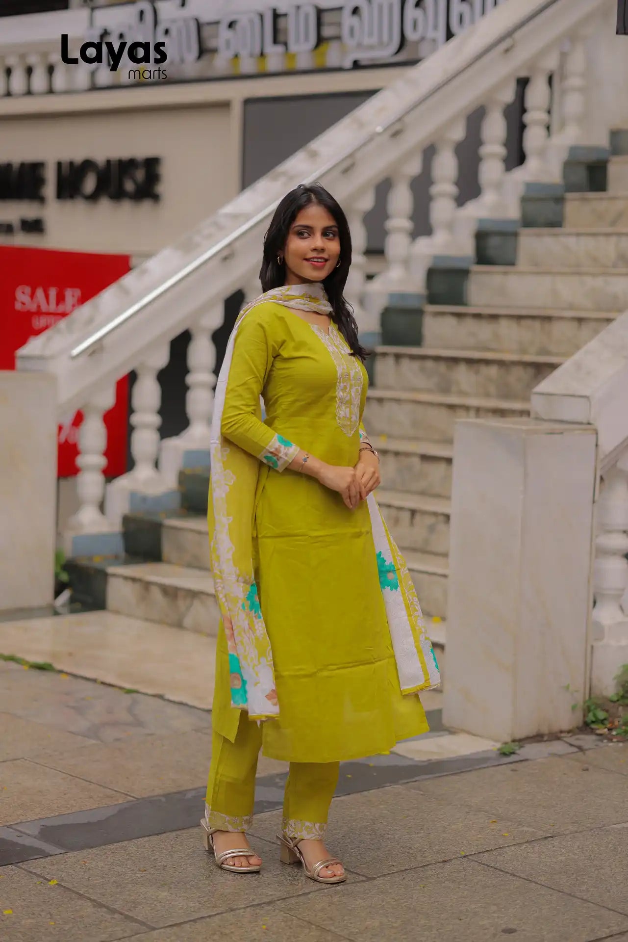 Side pose of olive yellow cotton kurta with mulmul dupatta -Layas Marts
