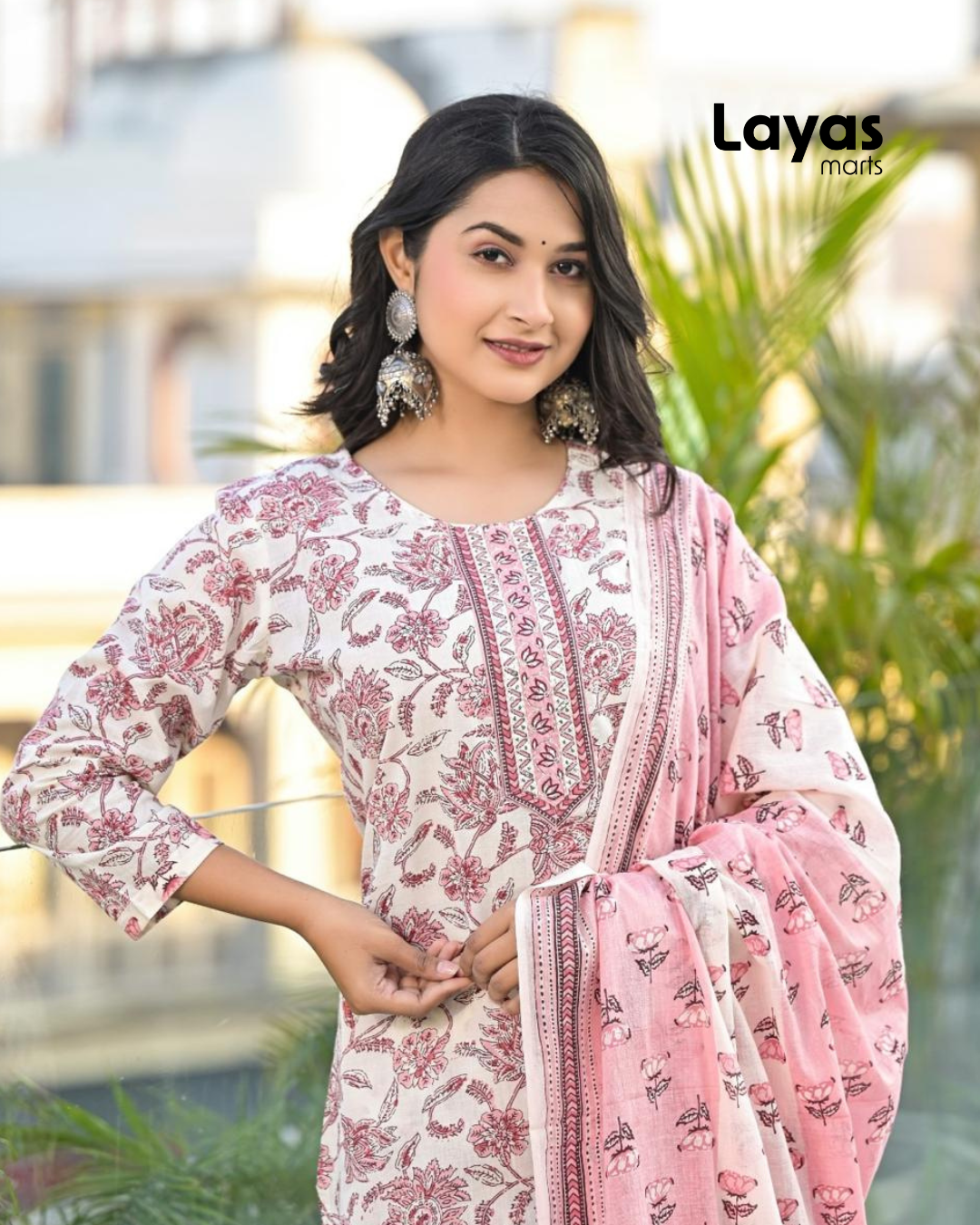 Side profile of pink floral kurta set with cotton dupatta