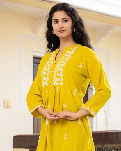 Yellow Cotton Chikankari Short Kurti paired with jeans for a chic casual look, perfect for modern Indian women, available at Layas Marts