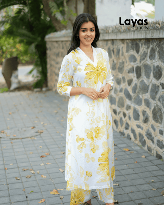 Elegant cotton co-ord set with yellow floral print and palazzo pants.
