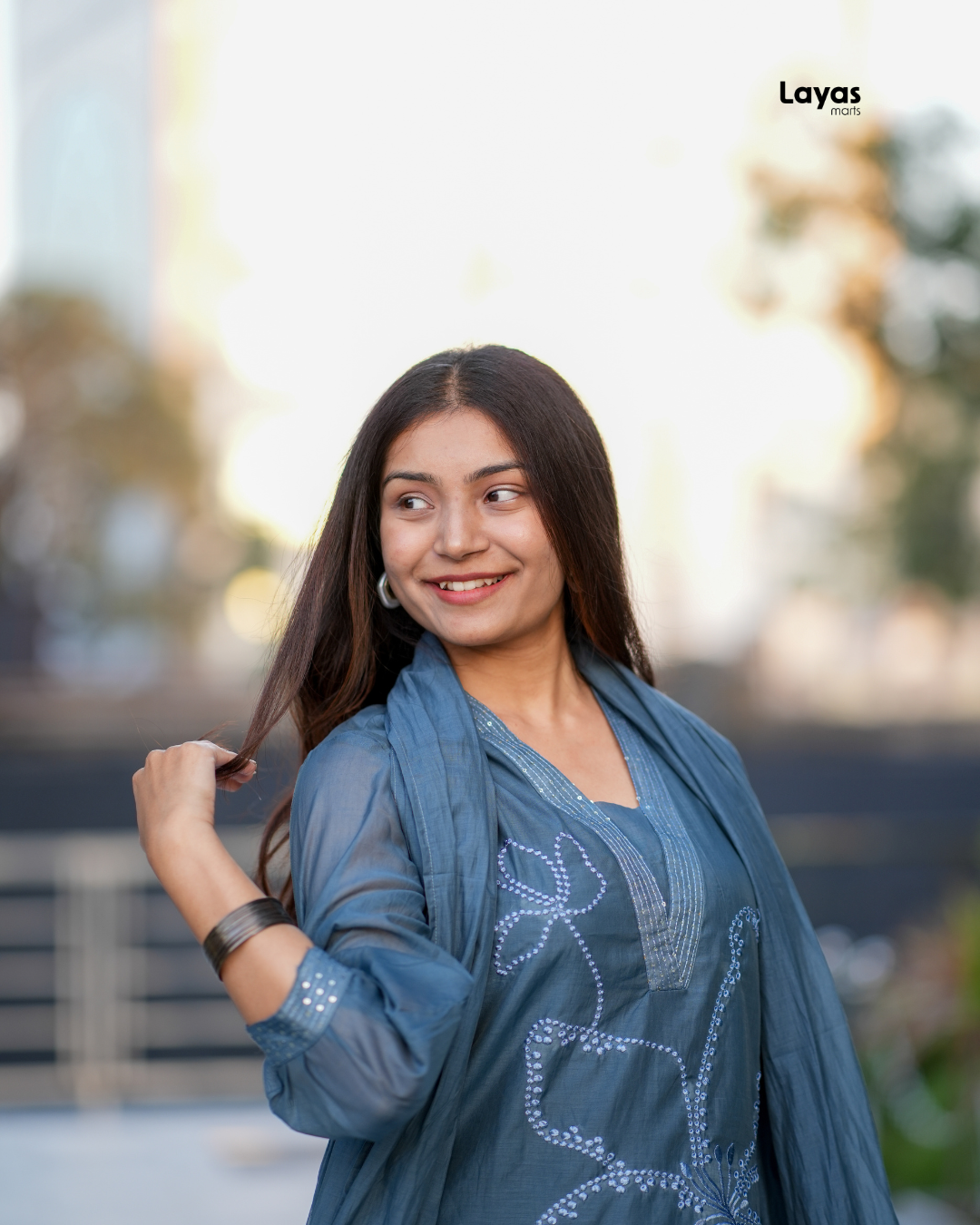 Model wearing Blue Grey Mul Chanderi Embroidered Kurta Set with dupatta and matching pants