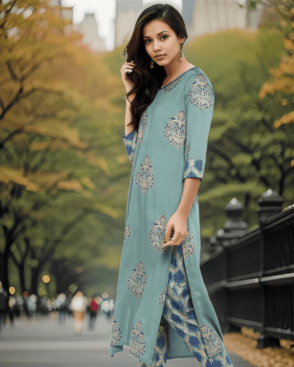 Elegant turquoise green kurta with foil print, round neckline, and three-quarter sleeves, perfect for everyday wear and festive occasions.