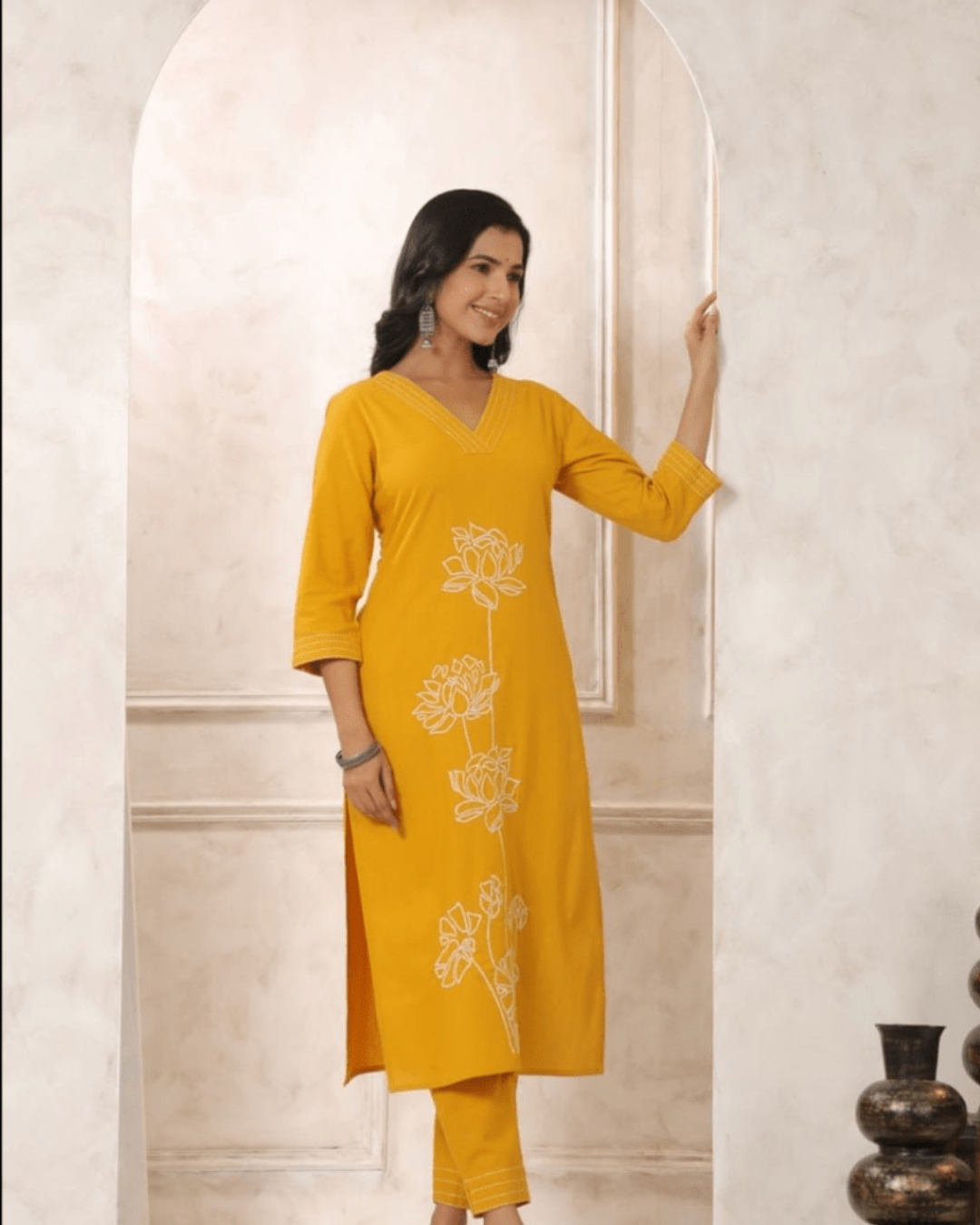 Pure cotton top with intricate floral thread embroidery, V-neck, and 3/4 sleeves, part of the Yellow Co-ord Set from Layas Marts.