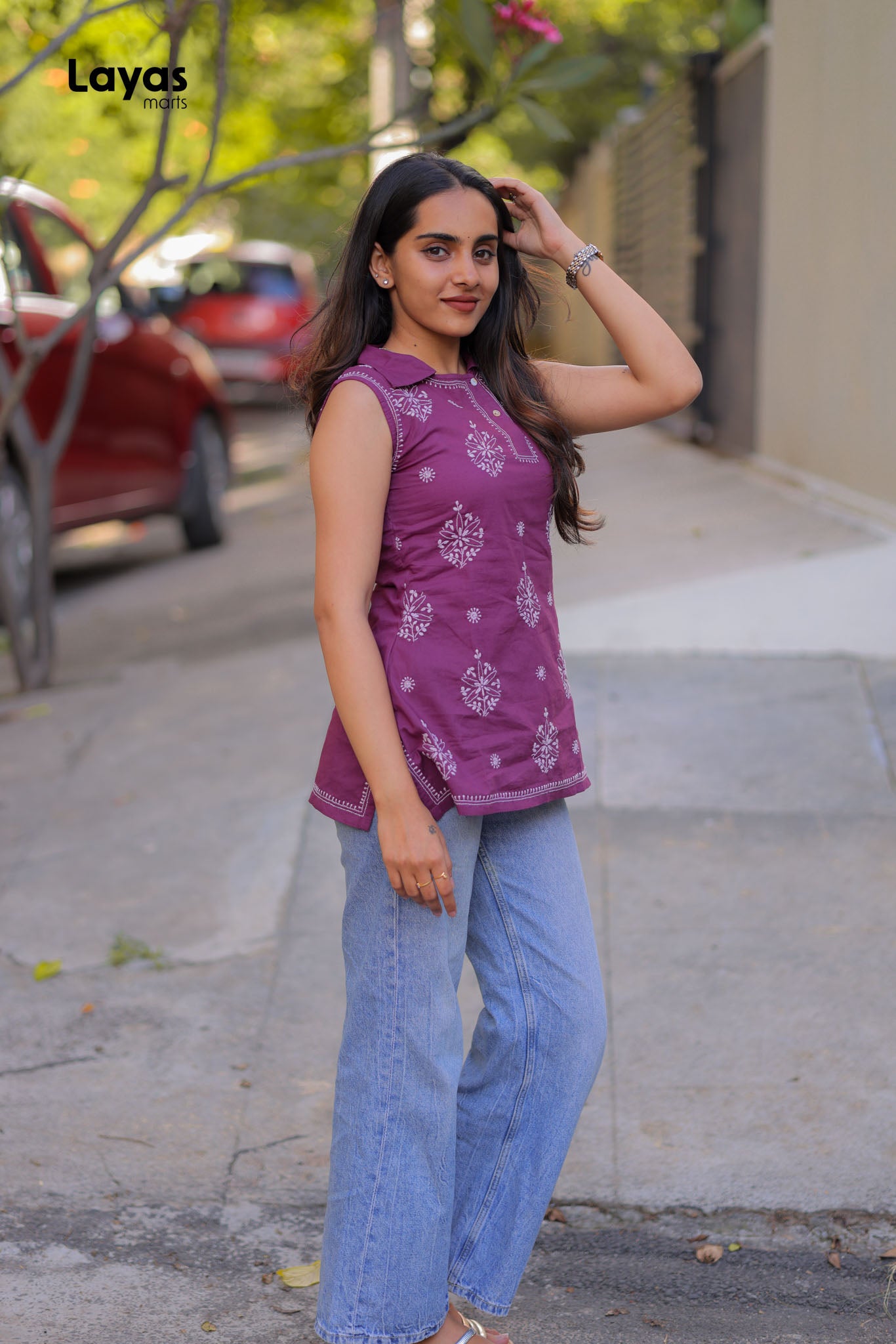 Jamun purple sleeveless cotton Chikankari short top styled with denims