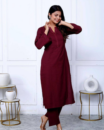 Functional and stylish maroon kurta set with intricate embroidery and breathable fabric.