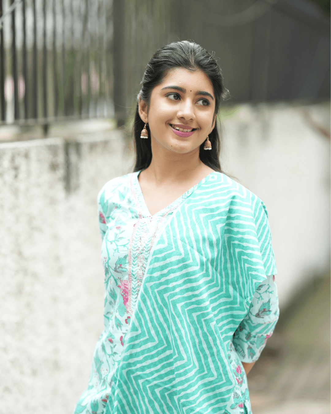 Stylish teal floral embroidered kurta set with V-neck, lightweight trousers, and matching dupatta, available online at Layas Marts.
