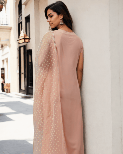 Stylish and lightweight peach-colored kurta set, ideal for casual outings and festive occasions.