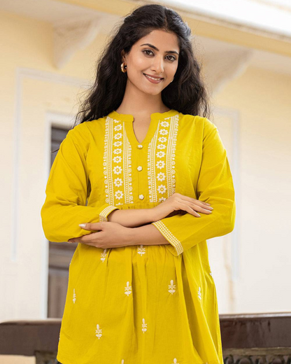 Yellow Cotton Chikankari Short Kurti paired with jeans for a chic casual look, perfect for modern Indian women, available at Layas Marts