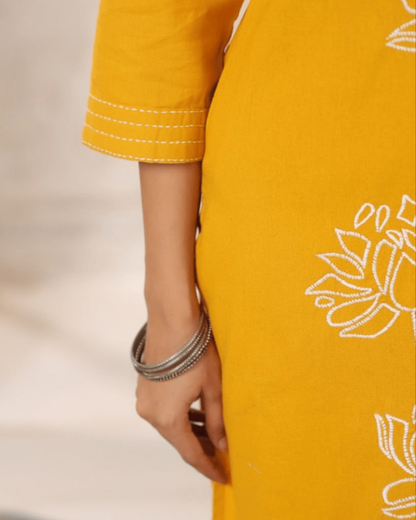 Yellow Floral Embroidered Co-ord Set styled with silver earrings, perfect for festive and casual occasions from Layas Marts.
