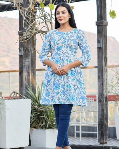 Trendy sky blue floral top with a relaxed silhouette, crafted from breathable cotton fabric for ultimate comfort.