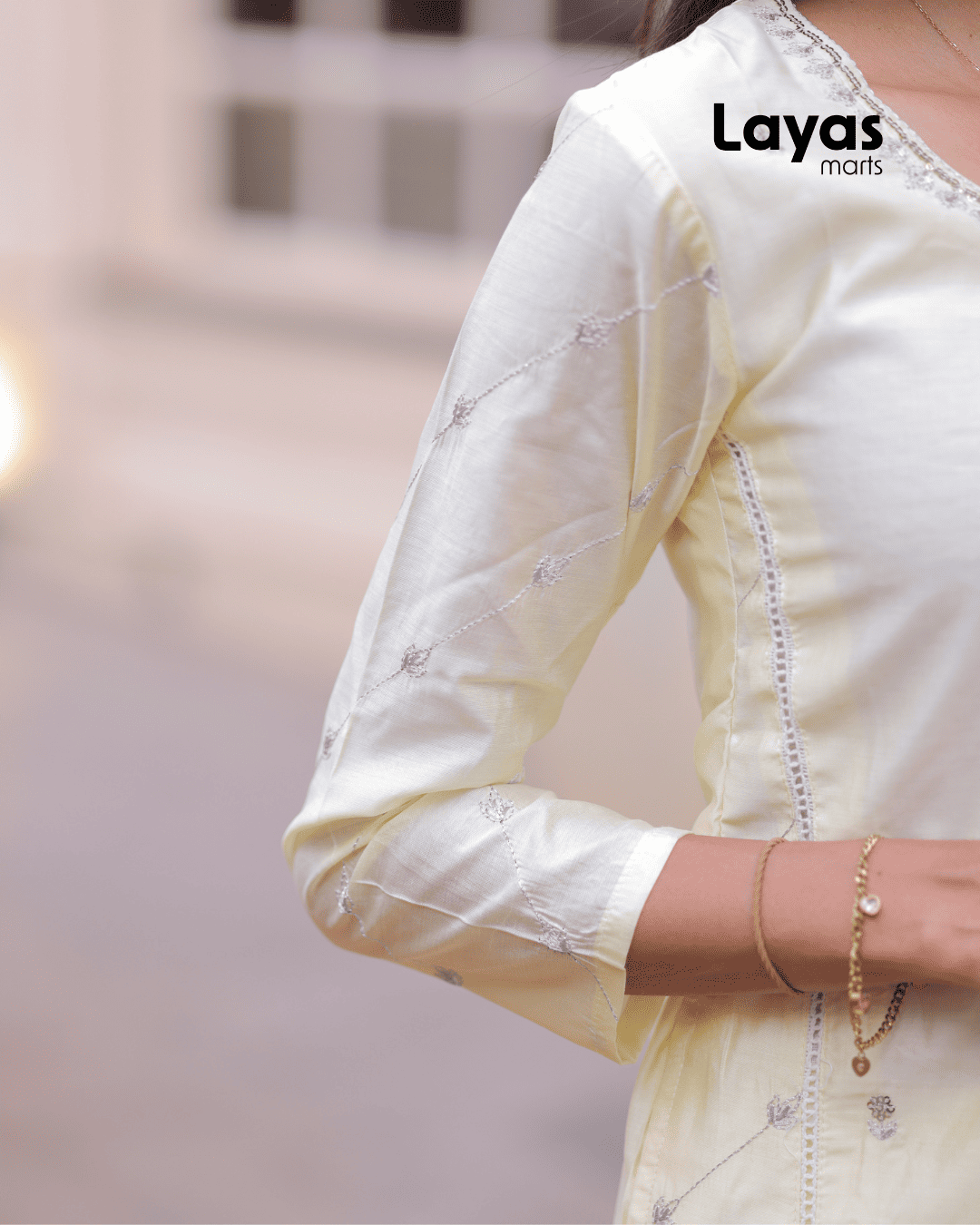 Side view showing 2 functional pockets and floral zari embroidery on yellow kurta